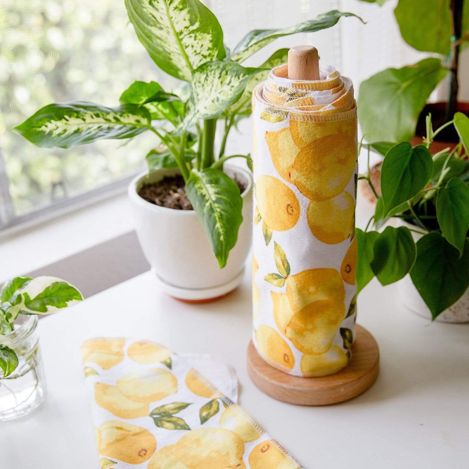 One roll of bamboo toilet paper on top of a box of toilet paper