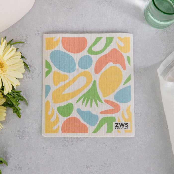 Zero Waste Sponge Cloth- Paper Towel Replacement, Kitchen Sponge Two dry sponge clothes held up. Left image has oranges, right image has lemons