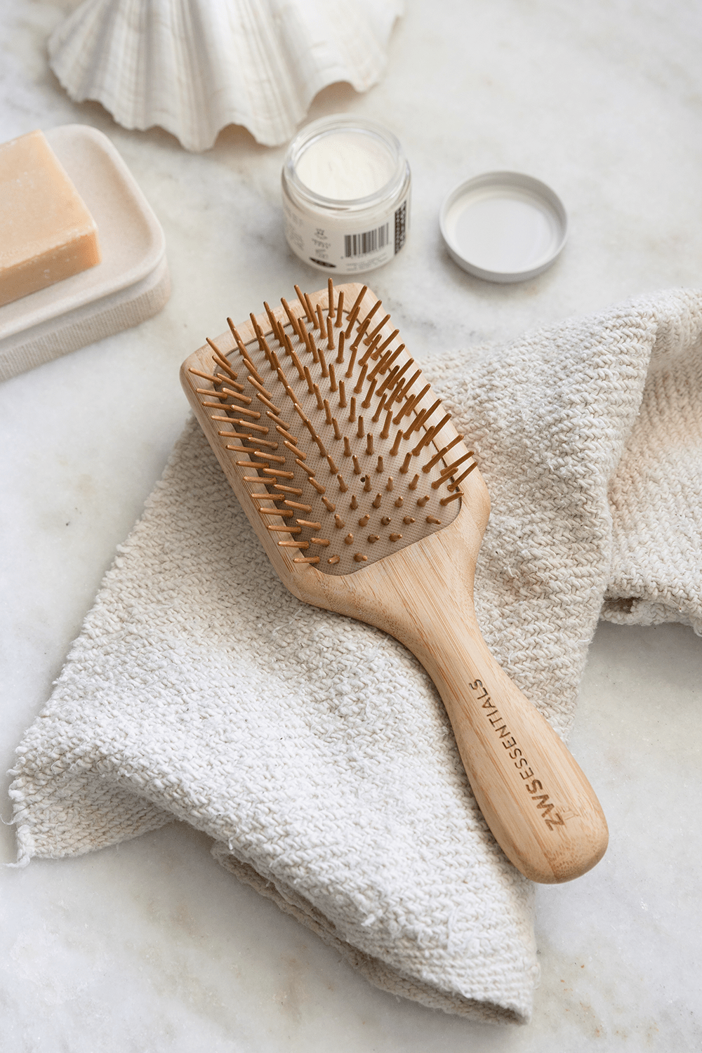 bamboo hair brush laying on counter