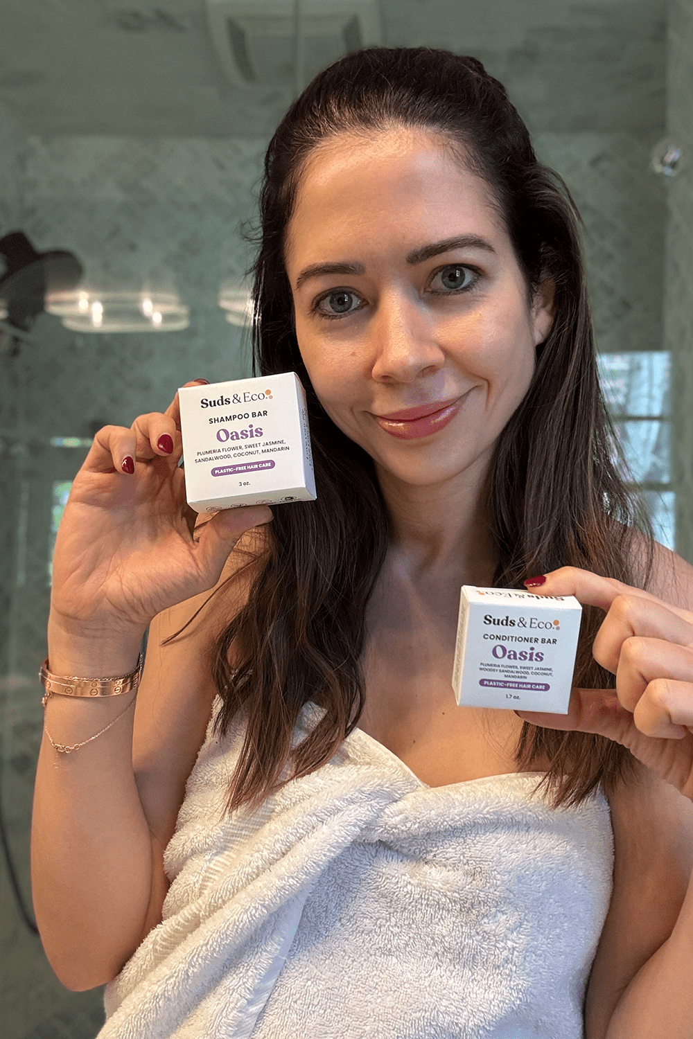 denisse holding shampoo bar and conditioner bar