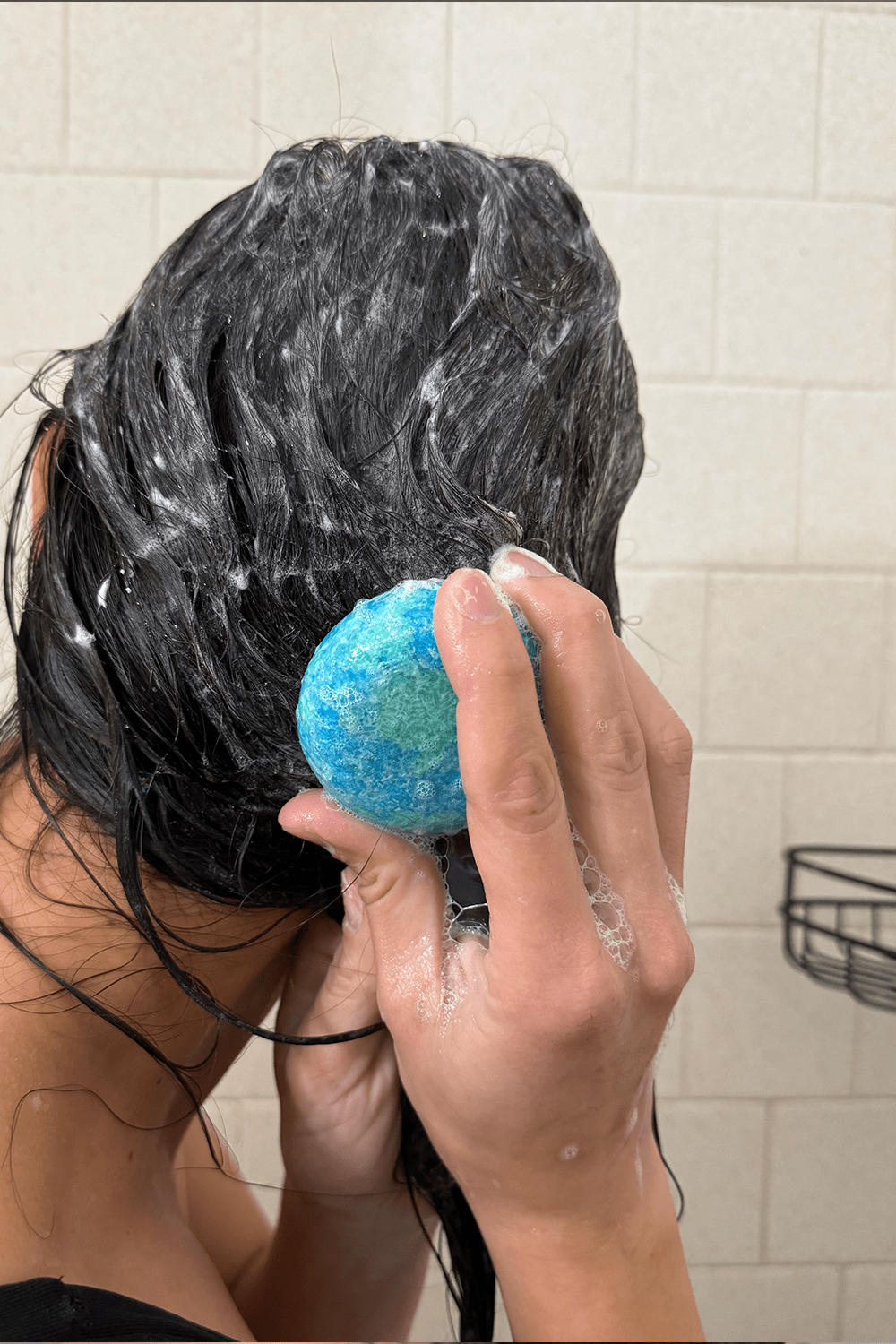 women washing hair with shampoo bar women washing hair with shampoo bar